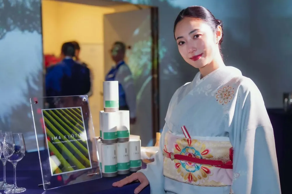 JAPANESE NIGHT in Cannes 2026 のIMA KYOTOブースに立つMEGUMIさん
